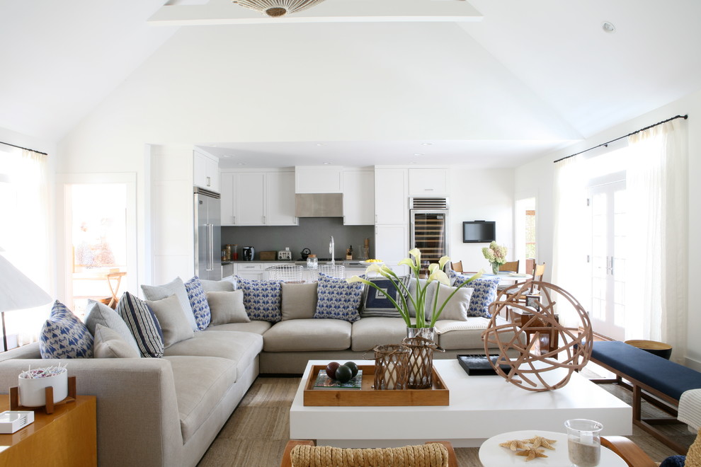 Design ideas for a beach style open concept living room in New York with white walls.