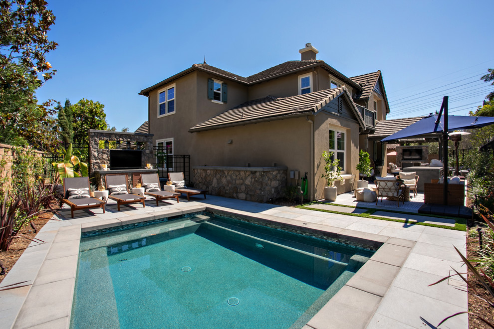 Example of a large transitional courtyard pool design
