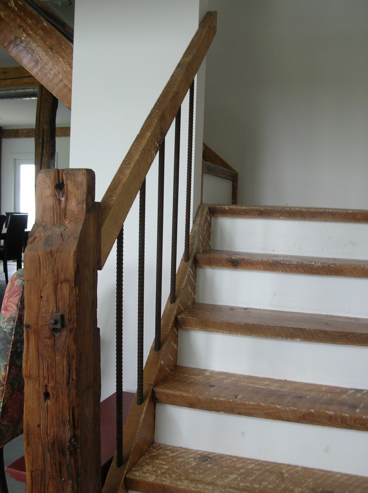 Design ideas for a mid-sized country wood floating staircase in Boston with open risers.