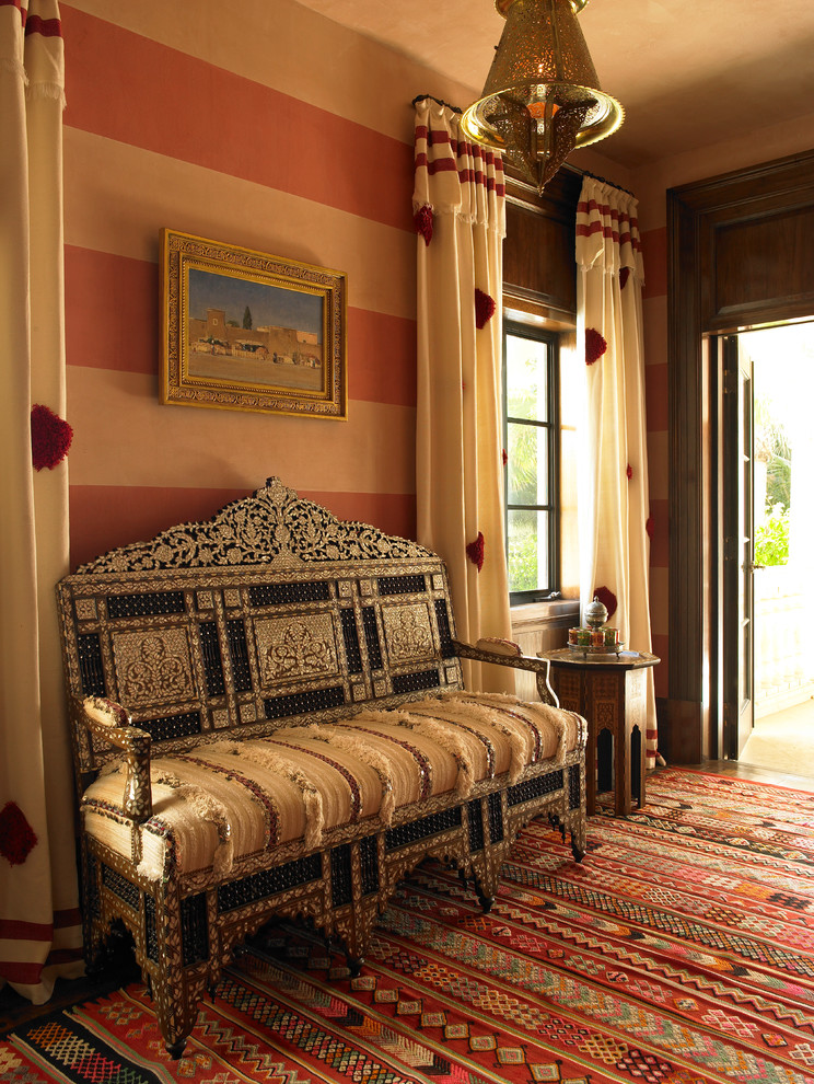This is an example of an expansive mediterranean master bedroom in New York with multi-coloured walls and carpet.