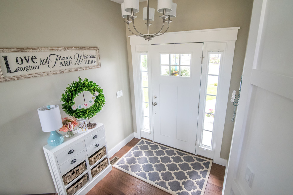 Inspiration for a mid-sized arts and crafts entry hall in Salt Lake City with beige walls, dark hardwood floors, a single front door and a white front door.