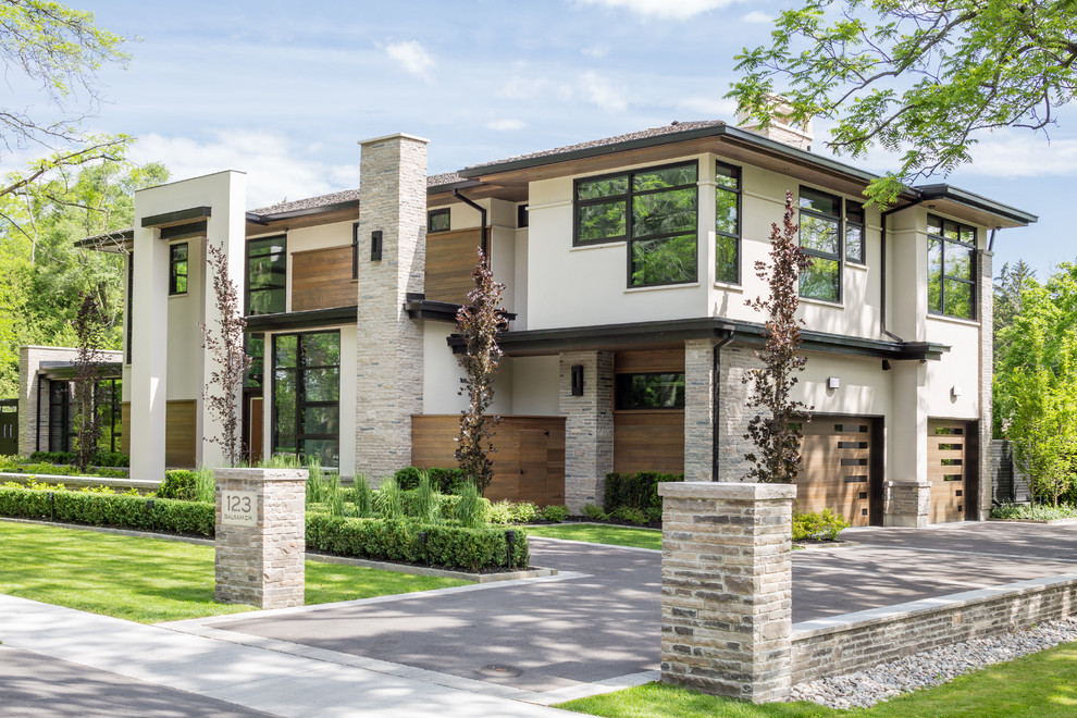 Large contemporary two-storey brown exterior in Toronto with wood siding.