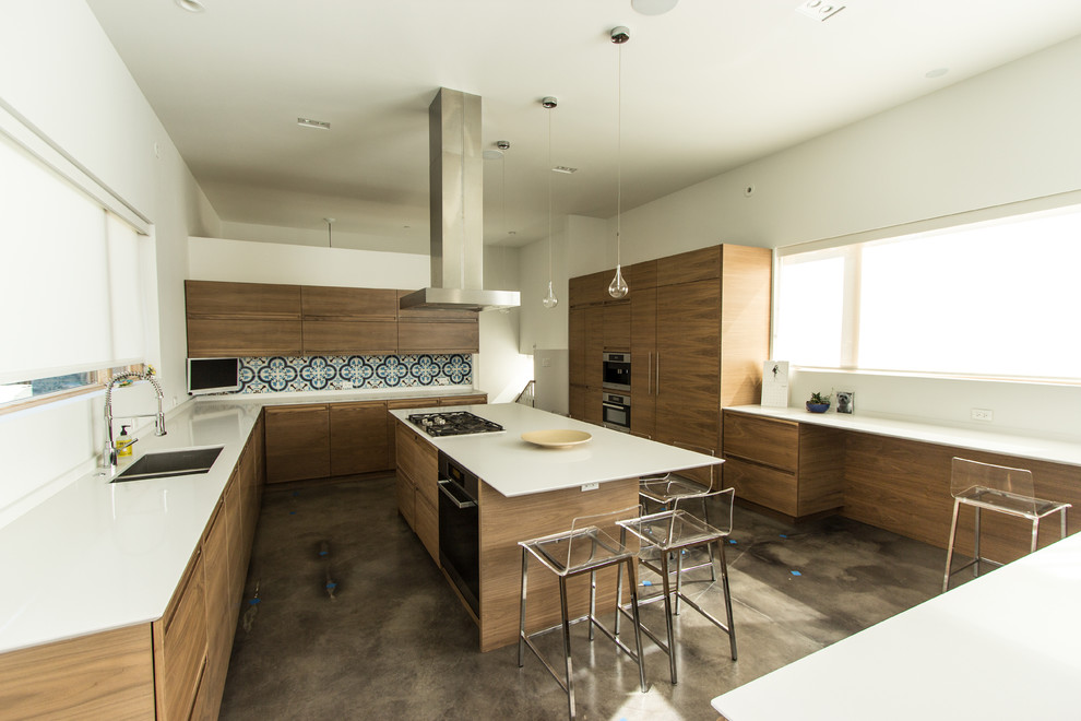 Design ideas for a large contemporary l-shaped separate kitchen in Chicago with an undermount sink, flat-panel cabinets, dark wood cabinets, quartz benchtops, multi-coloured splashback, cement tile splashback, panelled appliances, concrete floors, with island and brown floor.