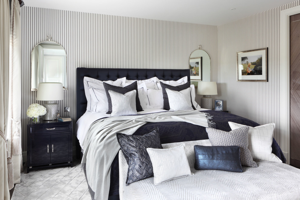 Inspiration for a mid-sized traditional master bedroom in London with multi-coloured walls.