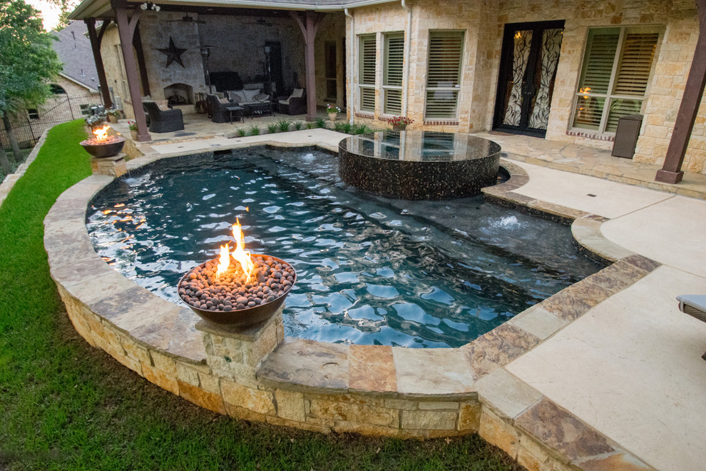 Design ideas for a small contemporary backyard custom-shaped pool in Dallas with a hot tub and natural stone pavers.