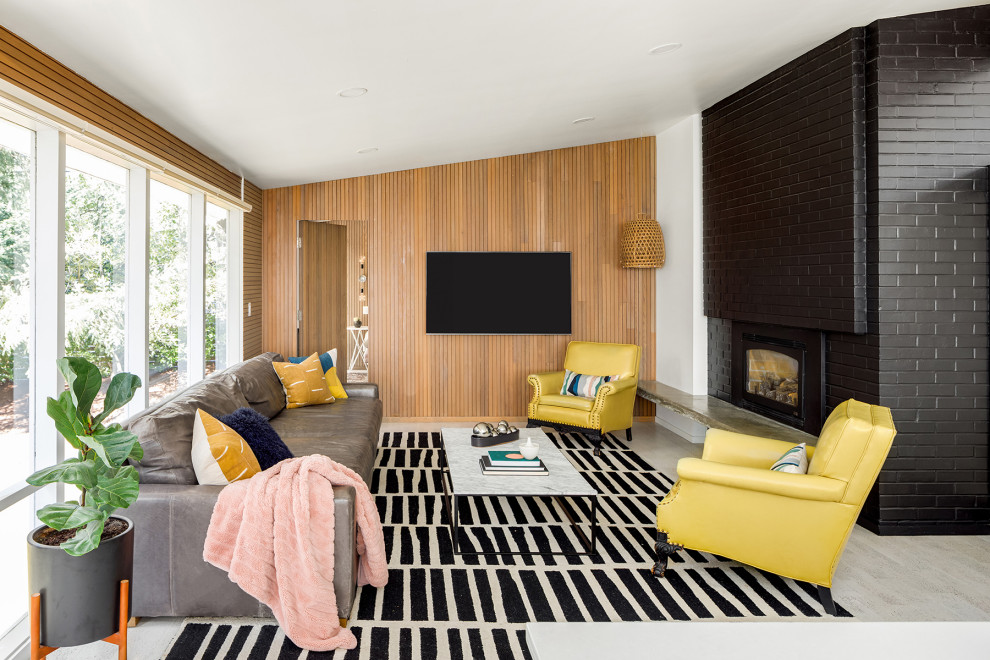 Midcentury family room in Seattle with white walls, a brick fireplace surround, white floor and panelled walls.