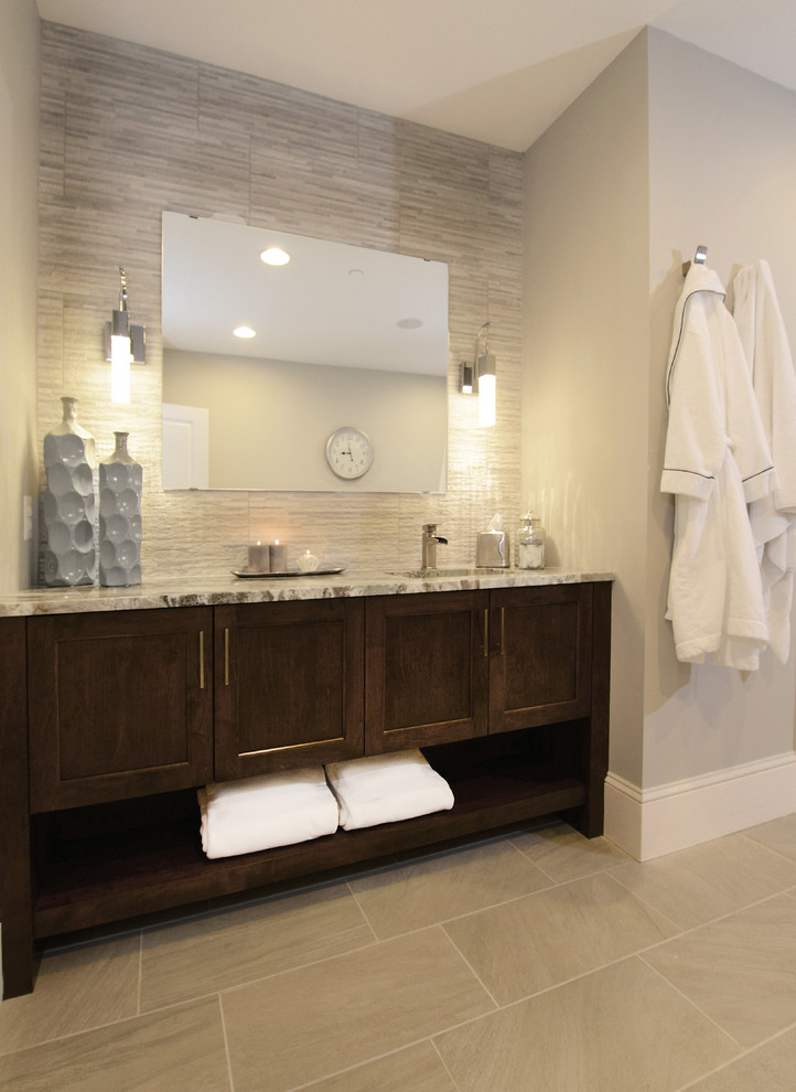 Photo of a large transitional bathroom in Baltimore with an undermount sink, shaker cabinets, dark wood cabinets, marble benchtops, gray tile, glass tile, grey walls, porcelain floors, with a sauna and beige floor.