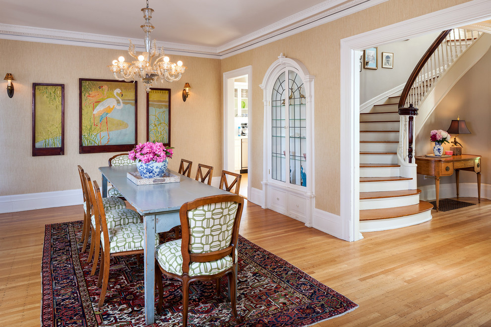 This is an example of a traditional dining room in Portland with beige walls and medium hardwood floors.