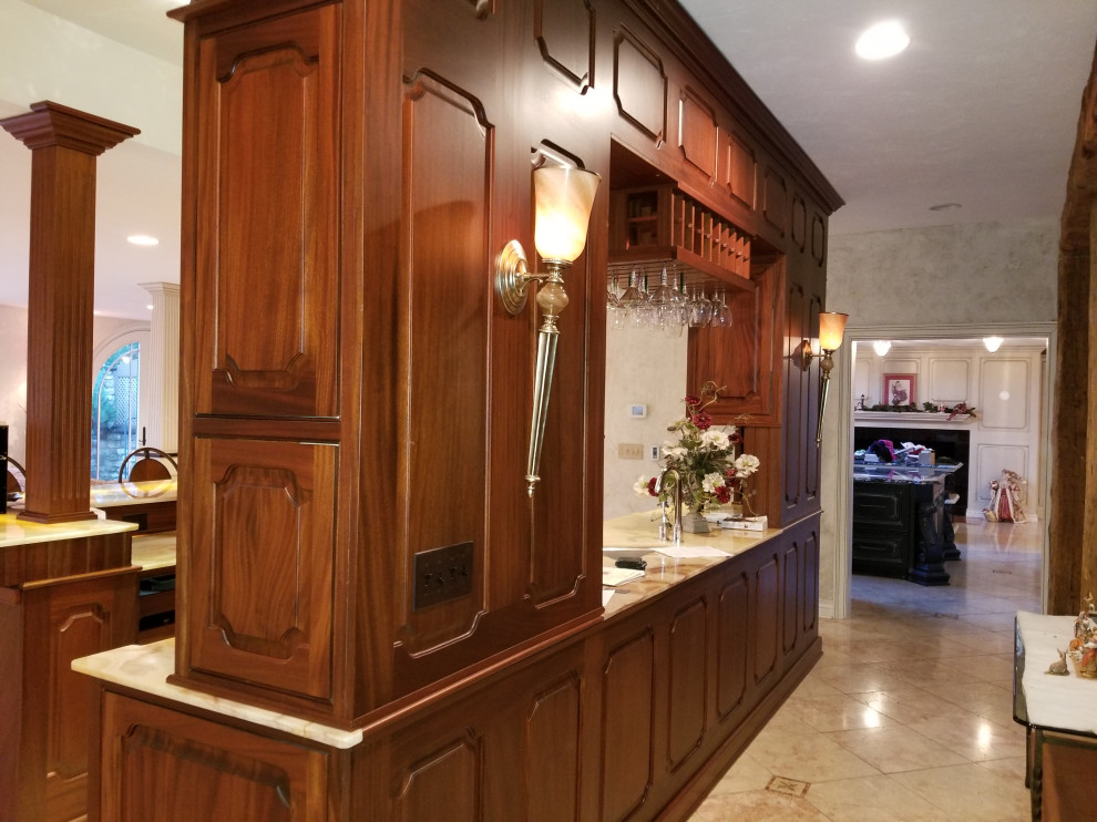 Design ideas for a large traditional galley wet bar in Other with raised-panel cabinets, medium wood cabinets, onyx benchtops and yellow benchtop.