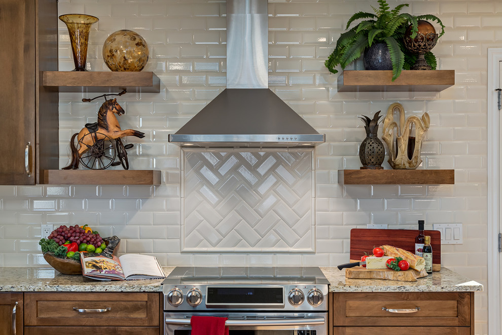 Example of a transitional home design design in Calgary