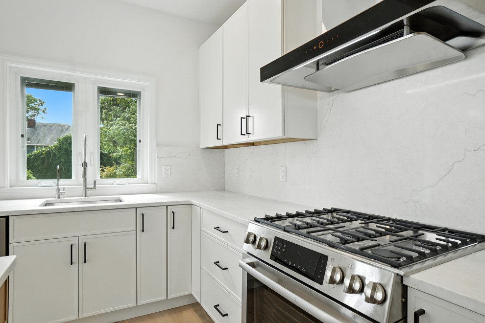 Stone Slab Backsplash and Modern Range Hood