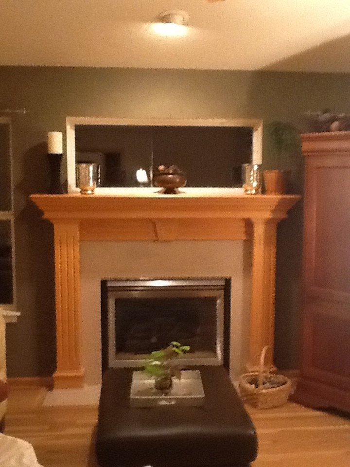 No clue how to decorate this fireplace mantle with a window over it!