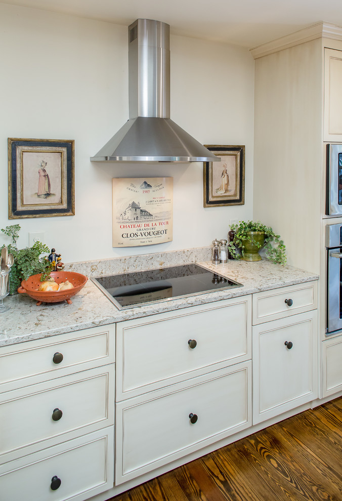 Inspiration for a mid-sized traditional galley eat-in kitchen in Atlanta with an undermount sink, recessed-panel cabinets, distressed cabinets, quartz benchtops, stainless steel appliances, dark hardwood floors and with island.
