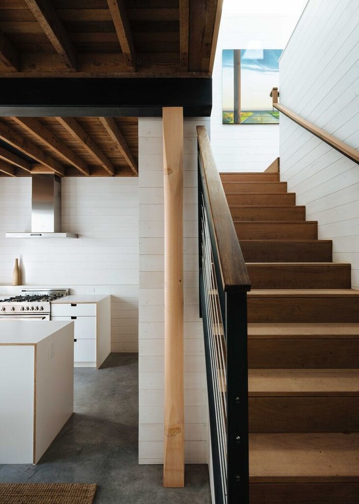 Design ideas for a mid-sized contemporary wood l-shaped staircase in San Francisco with wood risers.