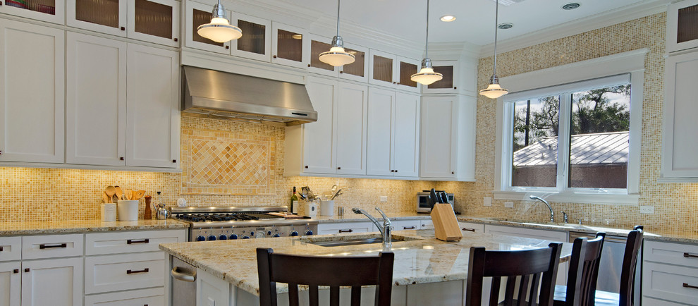 Kitchen - mid-sized transitional l-shaped kitchen idea in Miami with an undermount sink, recessed-panel cabinets, beige cabinets, granite countertops, beige backsplash, mosaic tile backsplash, stainless steel appliances and an island