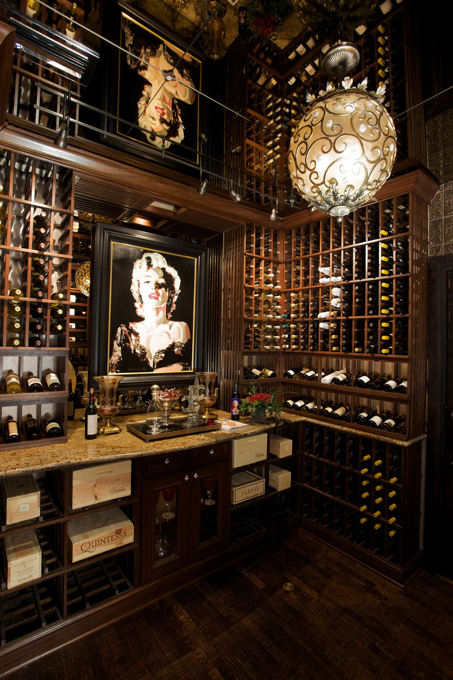 Inspiration for an expansive traditional wine cellar in Phoenix with dark hardwood floors, storage racks and brown floor.