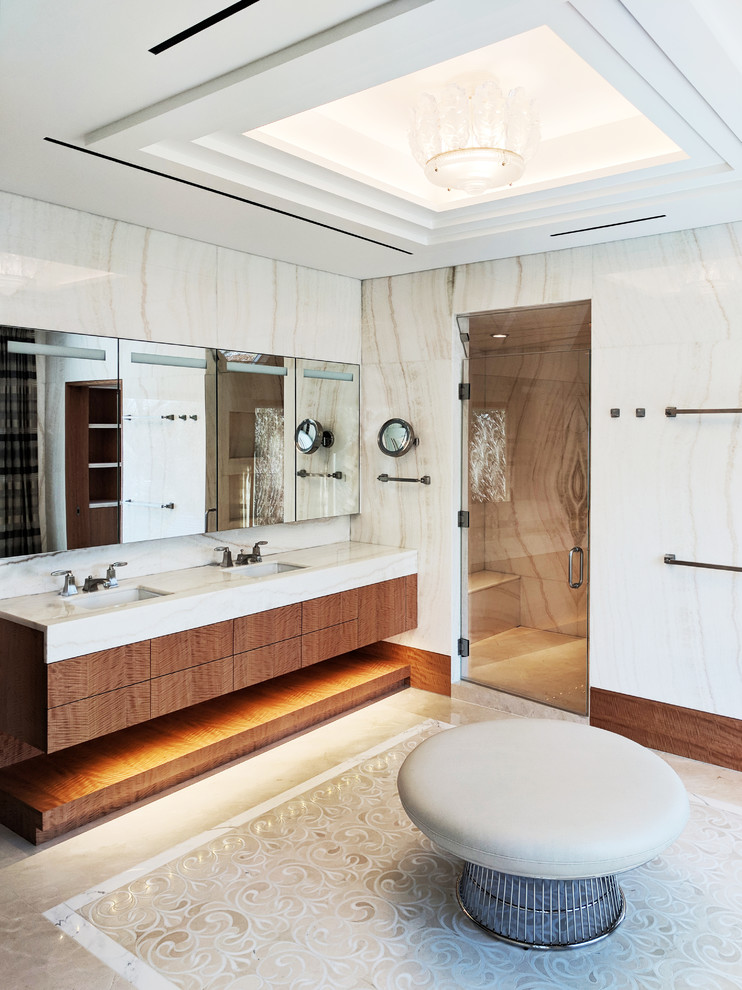 This is an example of a contemporary master bathroom in Other with flat-panel cabinets, dark wood cabinets, beige tile, multi-coloured tile, white tile, stone slab, multi-coloured walls, an undermount sink, multi-coloured floor, a hinged shower door and white benchtops.