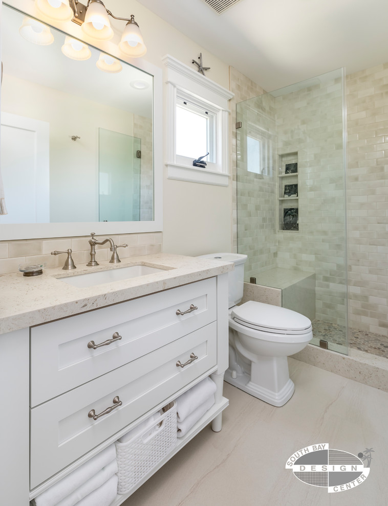 Design ideas for a mid-sized transitional master bathroom in Los Angeles with shaker cabinets, white cabinets, an alcove tub, a shower/bathtub combo, a two-piece toilet, blue tile, ceramic tile, white walls, ceramic floors, an undermount sink, engineered quartz benchtops, beige floor and a shower curtain.