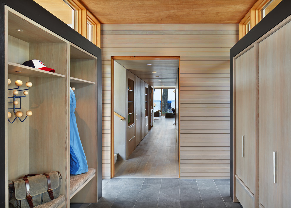 Mudroom - small modern slate floor and black floor mudroom idea in Minneapolis