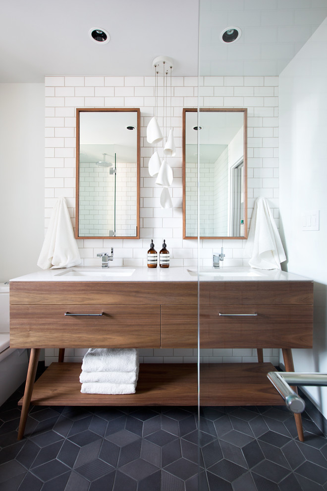 Mid-sized contemporary master bathroom in Vancouver with an undermount sink, white tile, subway tile, white walls, medium wood cabinets, engineered quartz benchtops, ceramic floors and flat-panel cabinets.