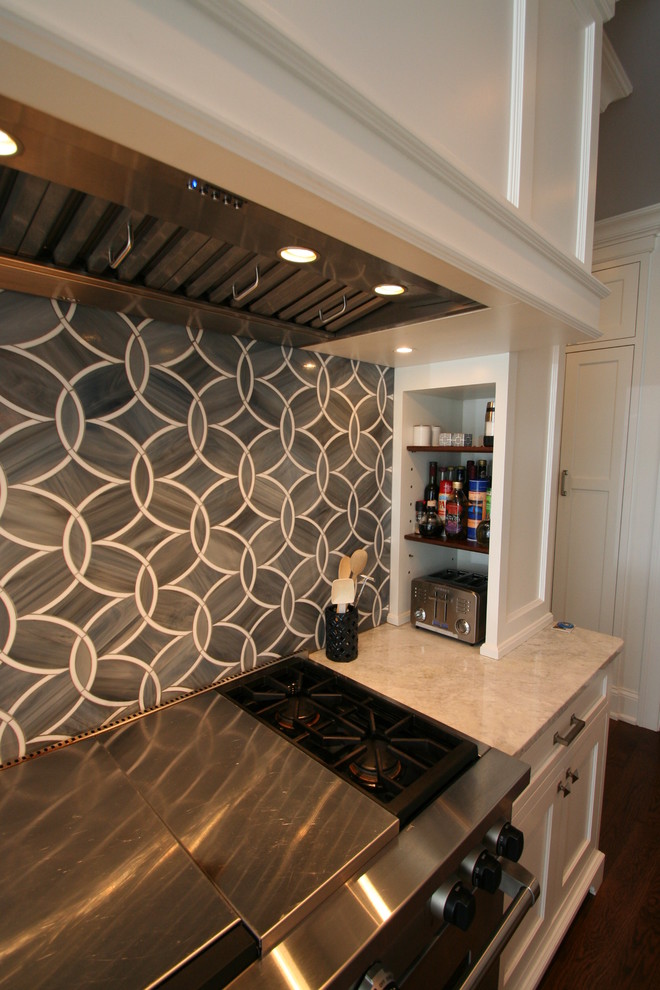 Example of a large transitional l-shaped dark wood floor open concept kitchen design in Chicago with flat-panel cabinets, white cabinets, granite countertops, blue backsplash, ceramic backsplash, stainless steel appliances and an island