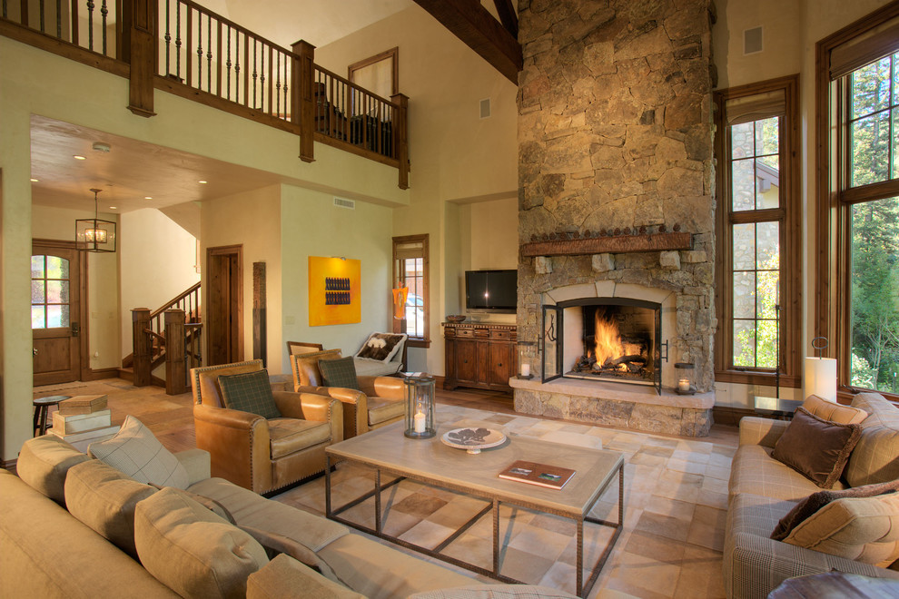 Design ideas for a traditional living room in Denver with a stone fireplace surround, no tv and beige floor.