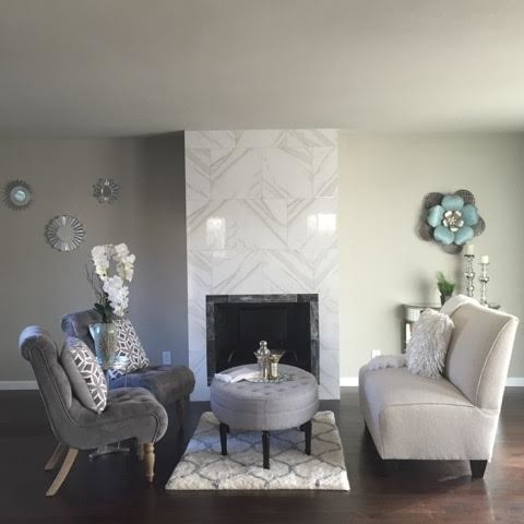 Photo of a small contemporary living room in San Diego with grey walls, dark hardwood floors, a standard fireplace, a tile fireplace surround and no tv.