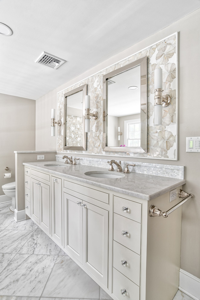 Inspiration for a large traditional master bathroom in New York with beaded inset cabinets, an undermount tub, white tile, mosaic tile, marble floors, an undermount sink, quartzite benchtops, white floor, a hinged shower door and white benchtops.