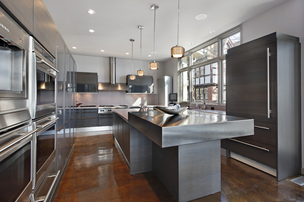 This is an example of a large modern u-shaped separate kitchen in Other with a double-bowl sink, flat-panel cabinets, grey cabinets, zinc benchtops, panelled appliances, concrete floors, with island and brown floor.