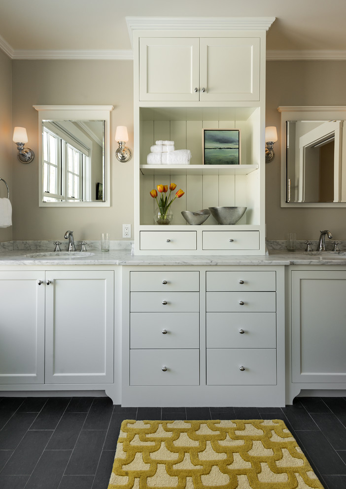 Photo of a mid-sized traditional bathroom in Portland Maine with an undermount sink, recessed-panel cabinets, white cabinets, marble benchtops, grey walls, slate floors and grey floor.