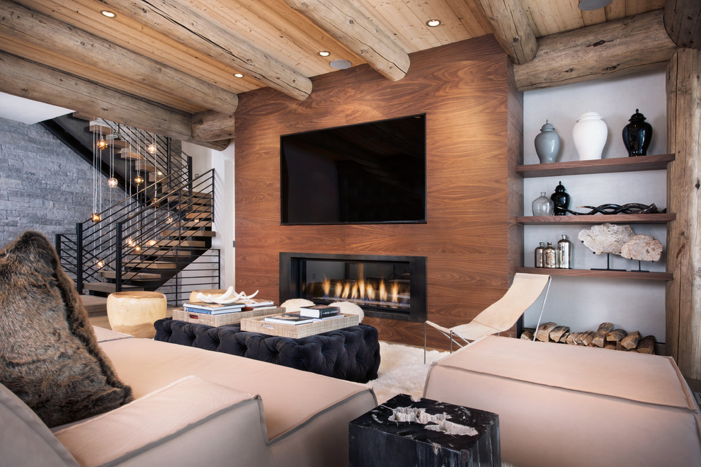 Vail Ski Haus - Mid-sized mountain style open concept family room photo in Denver with a ribbon fireplace, a wall-mounted tv and white walls