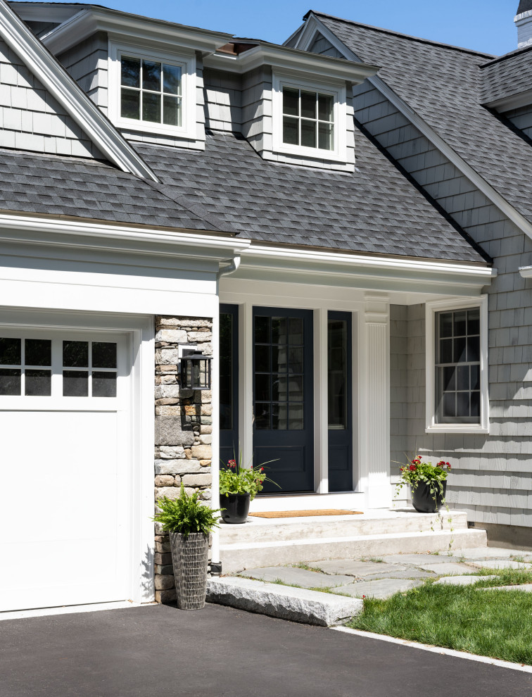 Design ideas for a traditional two-storey grey house exterior in Boston with mixed siding and shingle siding.