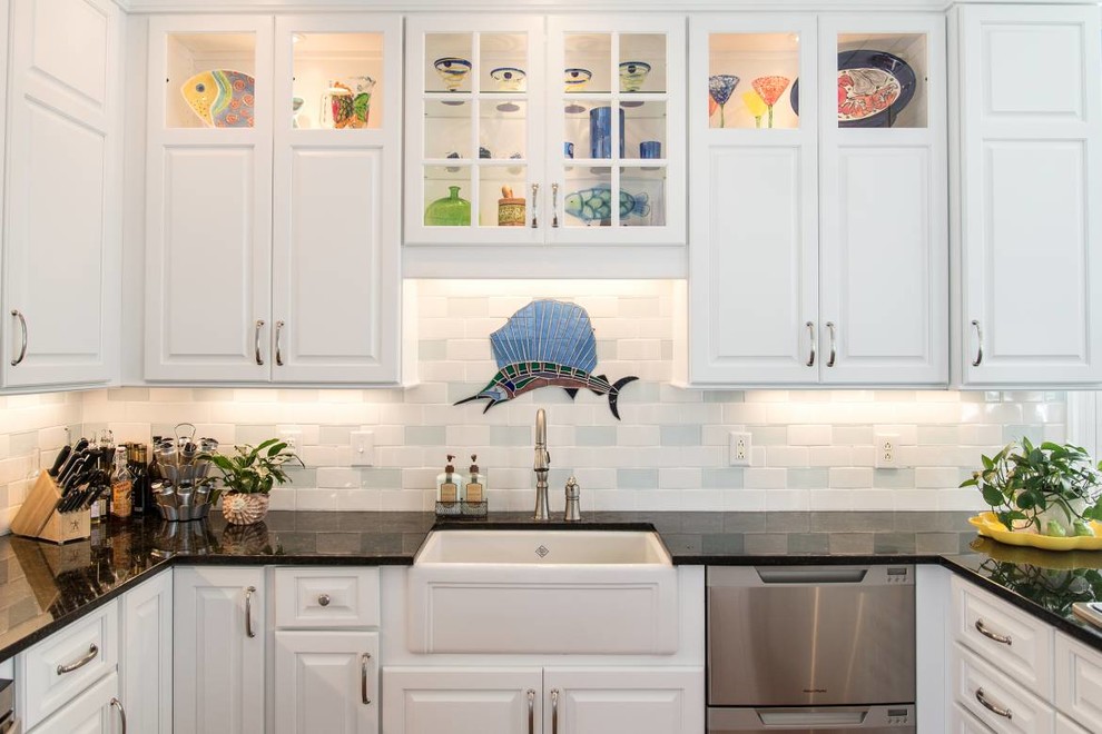 Kitchen - kitchen idea with white cabinets, granite countertops and cement tile backsplash