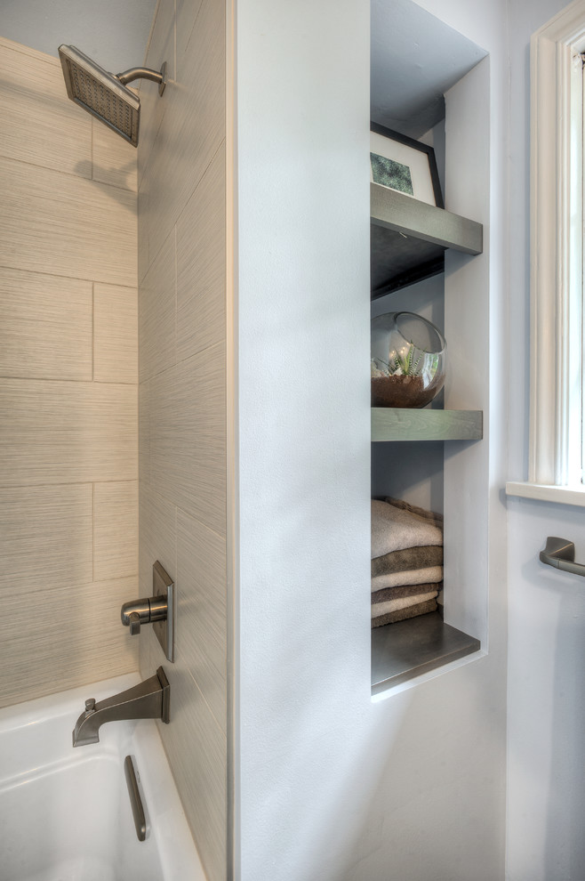 Mid-sized transitional master bathroom in Seattle with recessed-panel cabinets, white cabinets, an undermount tub, a shower/bathtub combo, a one-piece toilet, white tile, blue walls, concrete floors, an undermount sink and quartzite benchtops.