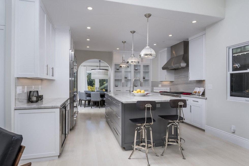 Inspiration for a large contemporary separate kitchen in San Francisco with light hardwood floors and white floor.