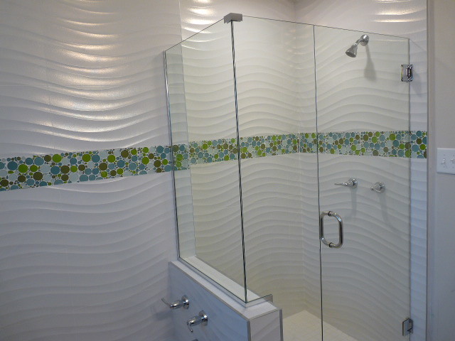 Photo of a modern bathroom in Los Angeles with white tile, porcelain tile and white walls.