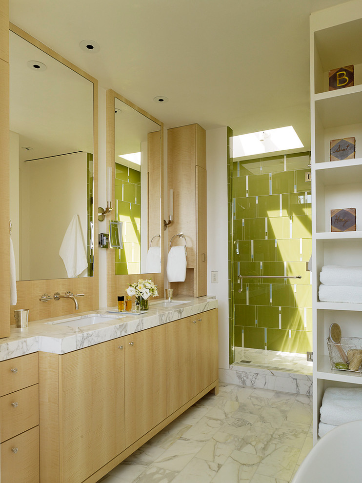 Large modern master bathroom in San Francisco with flat-panel cabinets, light wood cabinets, a freestanding tub, an alcove shower, green tile, ceramic tile, white walls, marble floors, an undermount sink and marble benchtops.