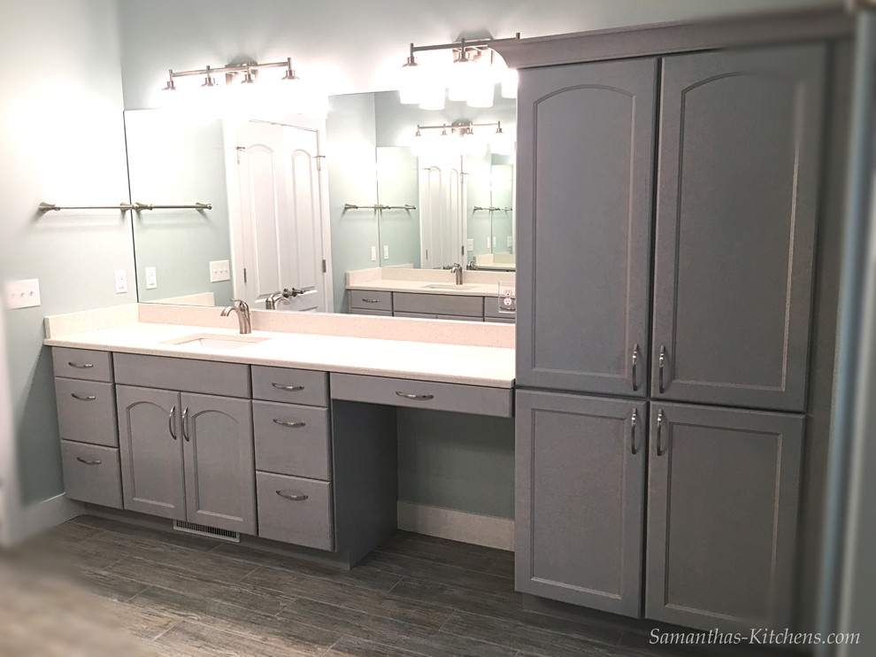 Home design - mid-sized transitional master porcelain tile home design idea with recessed-panel cabinets, gray cabinets, blue walls, an undermount sink and quartz countertops