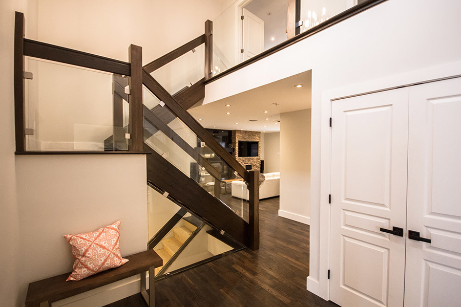 Example of a transitional wooden u-shaped open staircase design
