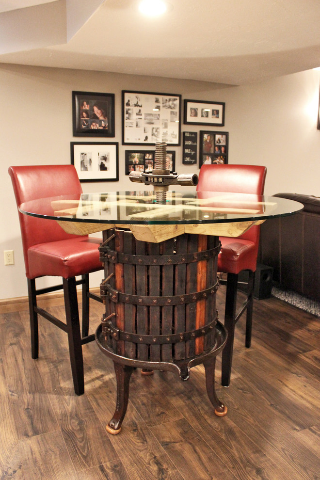 Example of a large mountain style underground medium tone wood floor and brown floor basement design in Cleveland with beige walls and no fireplace