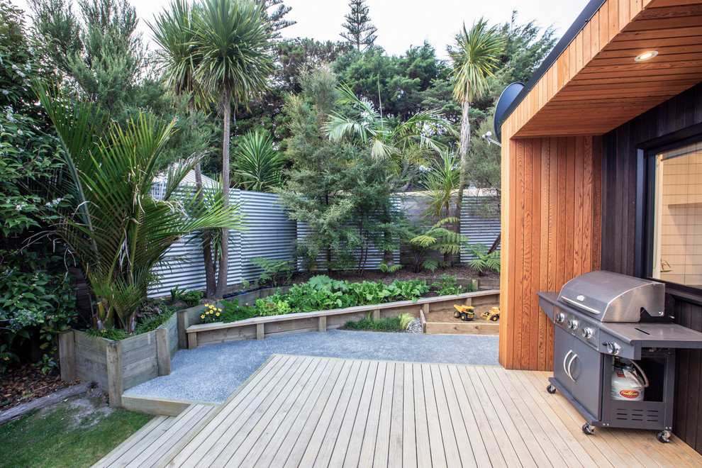 Photo of a mid-sized contemporary backyard deck in Auckland.