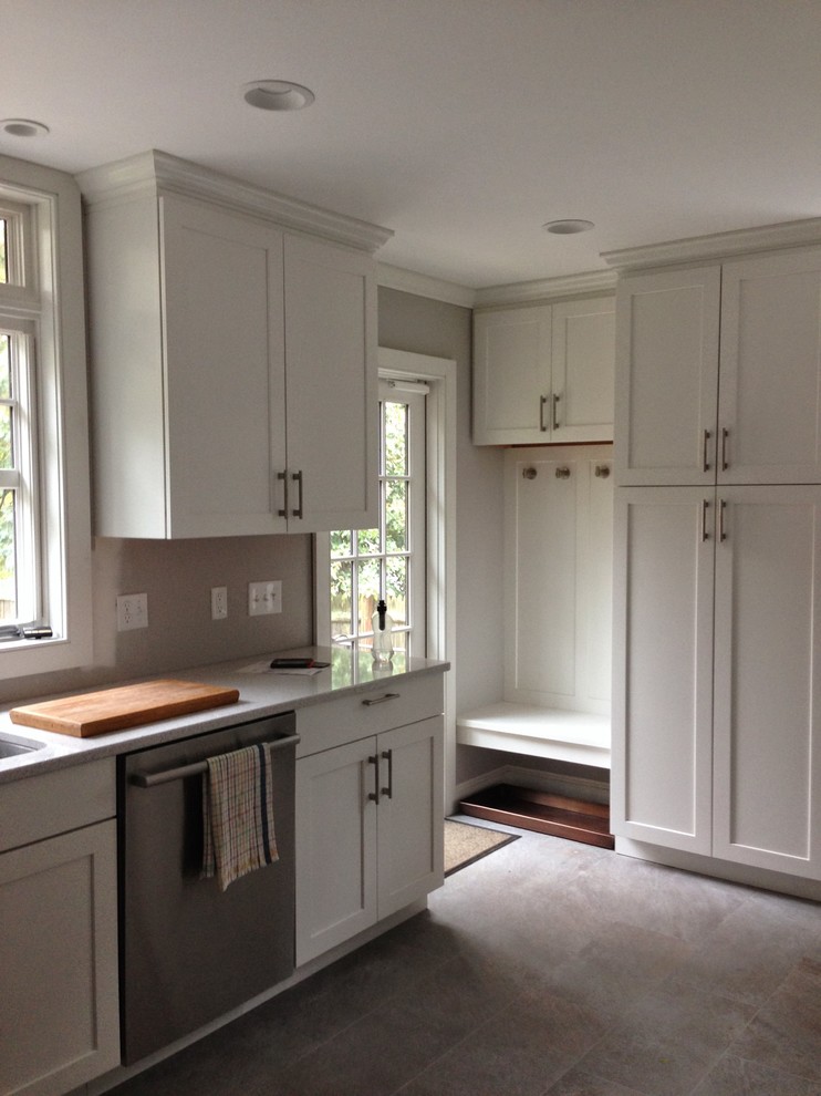Inspiration for a small traditional l-shaped eat-in kitchen in Boston with a double-bowl sink, shaker cabinets, white cabinets, quartz benchtops, stainless steel appliances, slate floors and no island.
