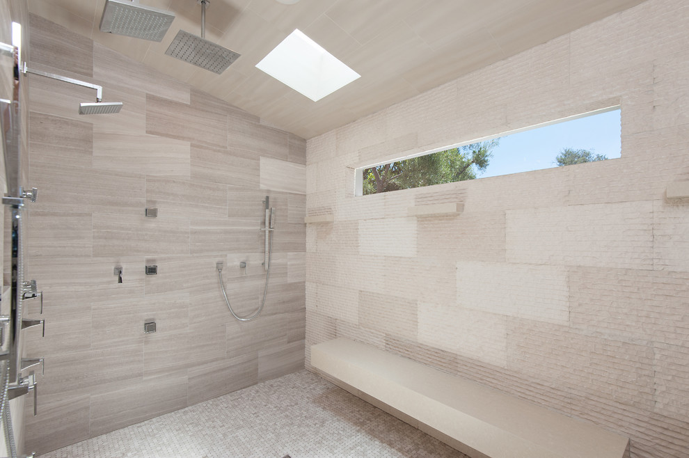 This is an example of an expansive modern bathroom in Los Angeles with an integrated sink, recessed-panel cabinets, dark wood cabinets, marble benchtops, a freestanding tub, a one-piece toilet, multi-coloured tile, mosaic tile, multi-coloured walls and light hardwood floors.