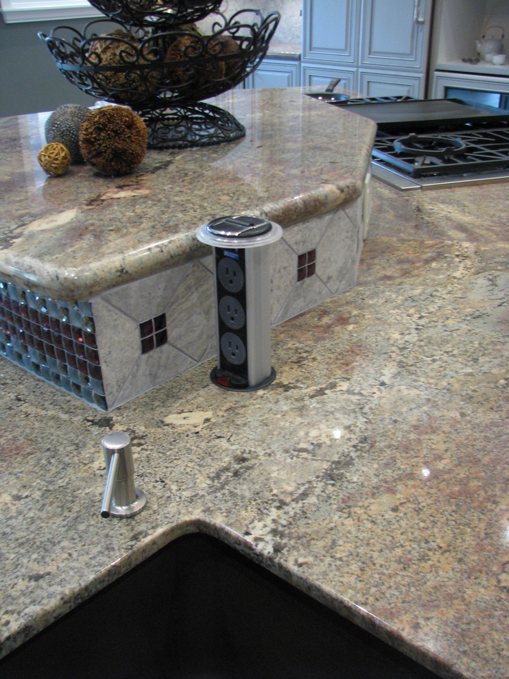 Huge transitional l-shaped porcelain tile open concept kitchen photo in Phoenix with an undermount sink, raised-panel cabinets, gray cabinets, granite countertops, gray backsplash, stone tile backsplash, stainless steel appliances and an island
