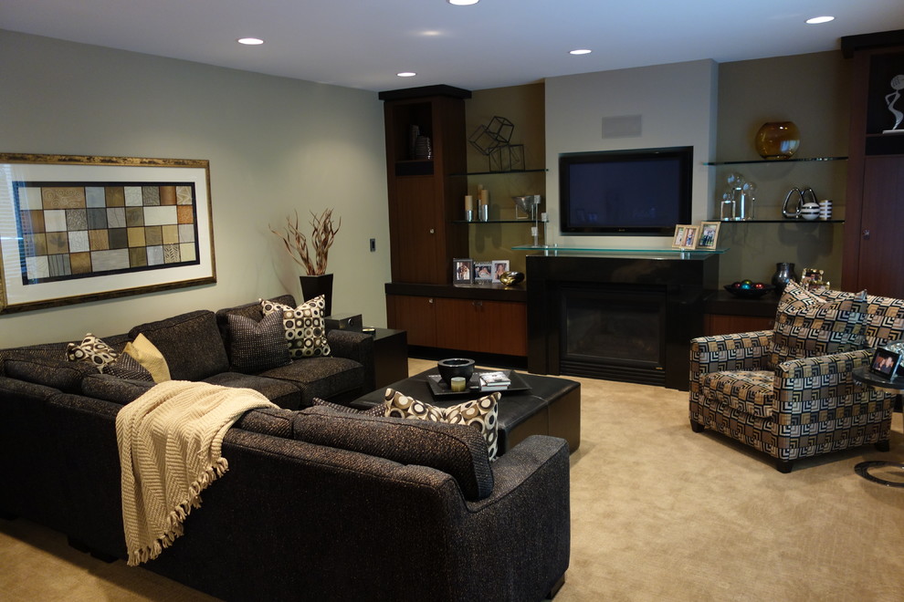 Photo of a mid-sized contemporary formal enclosed living room in Minneapolis with green walls, carpet, a standard fireplace, a metal fireplace surround and no tv.