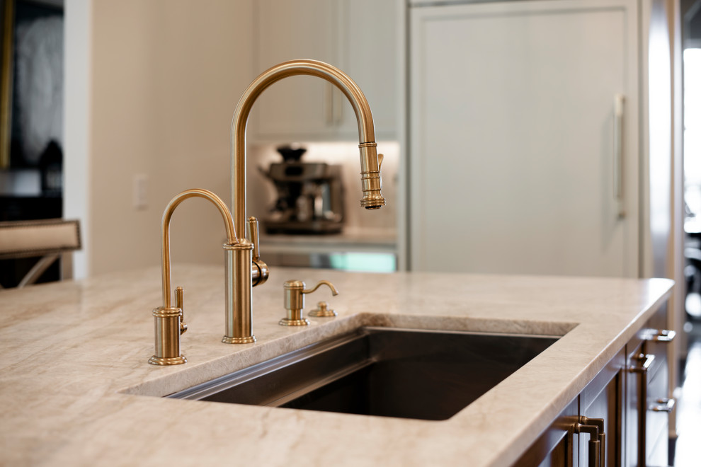 Large transitional l-shaped dark wood floor and brown floor open concept kitchen photo in Nashville with an undermount sink, beaded inset cabinets, white cabinets, quartzite countertops, beige backsplash, stone slab backsplash, stainless steel appliances, an island and beige countertops