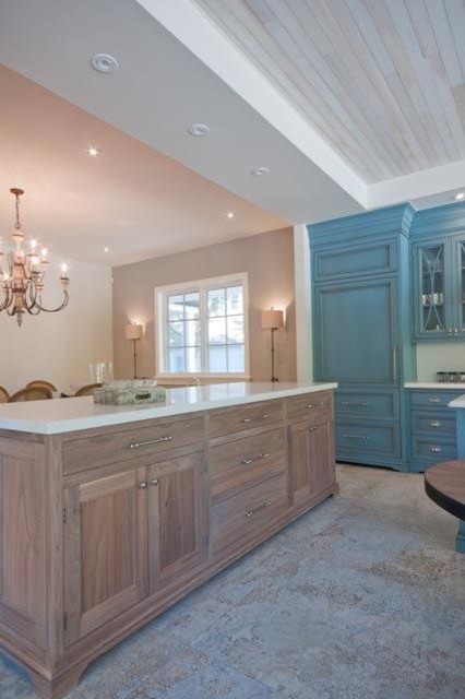 Large mountain style u-shaped ceramic tile eat-in kitchen photo in Toronto with a farmhouse sink, beaded inset cabinets, blue cabinets, quartzite countertops, white backsplash, stone slab backsplash, stainless steel appliances and an island