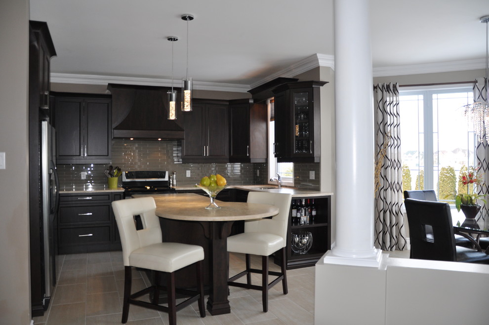 Open concept kitchen - large transitional u-shaped ceramic tile open concept kitchen idea in Ottawa with an undermount sink, shaker cabinets, dark wood cabinets, granite countertops, beige backsplash, glass tile backsplash, stainless steel appliances and an island