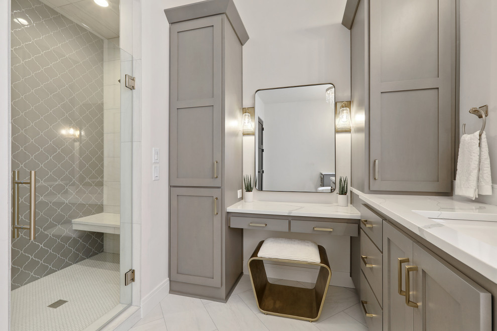 Inspiration for a large transitional master white tile and ceramic tile ceramic tile, white floor and double-sink doorless shower remodel with shaker cabinets, gray cabinets, white walls, an undermount sink, quartz countertops, a hinged shower door, white countertops and a built-in vanity