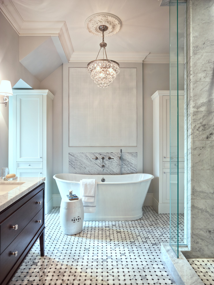 Traditional bathroom in Toronto with an undermount sink, flat-panel cabinets, dark wood cabinets, marble benchtops, a freestanding tub, an open shower, gray tile, mosaic tile, grey walls, marble floors and an open shower.